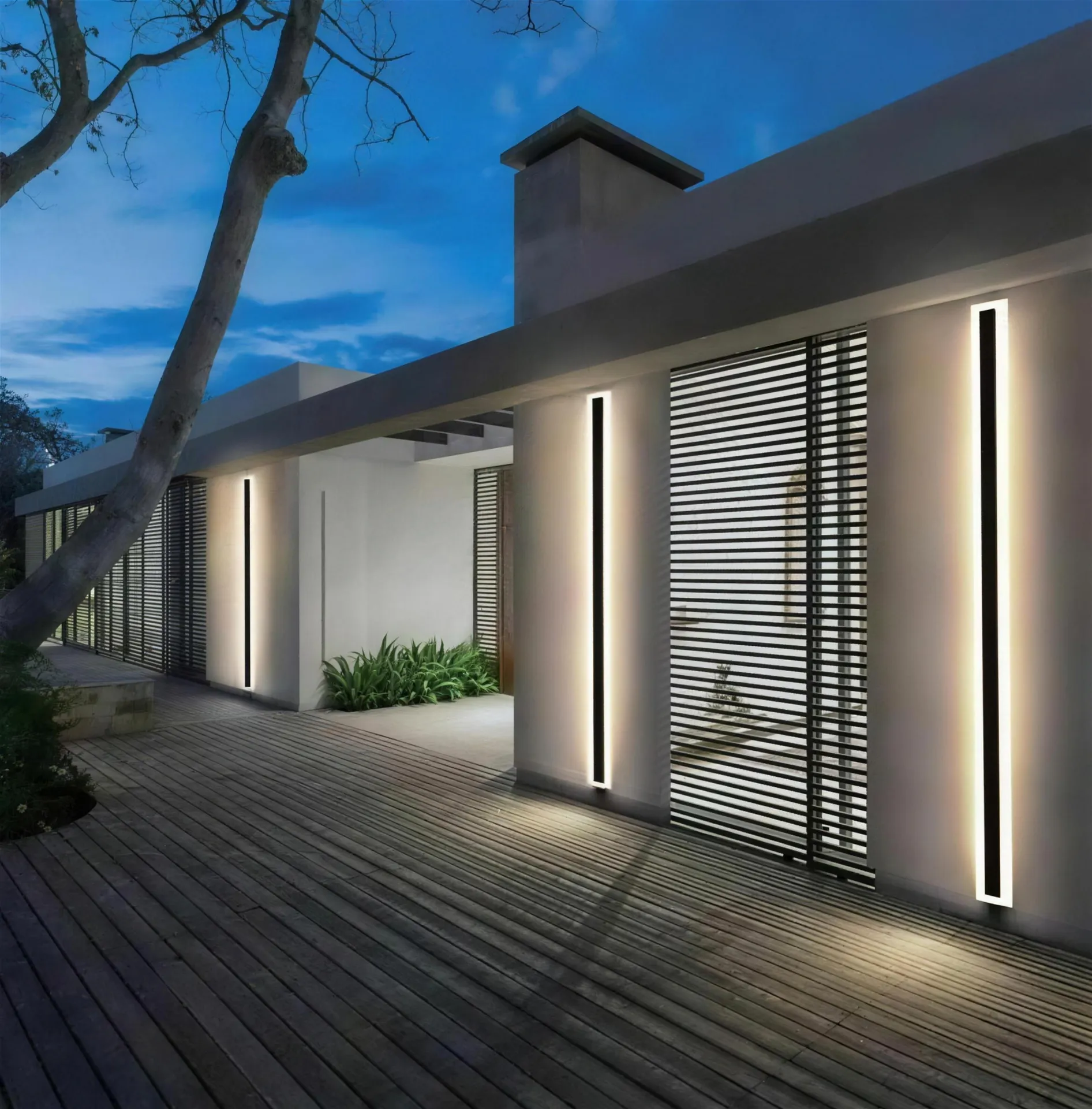 LUXFLARE linear profiles lighting a villa facade at dusk